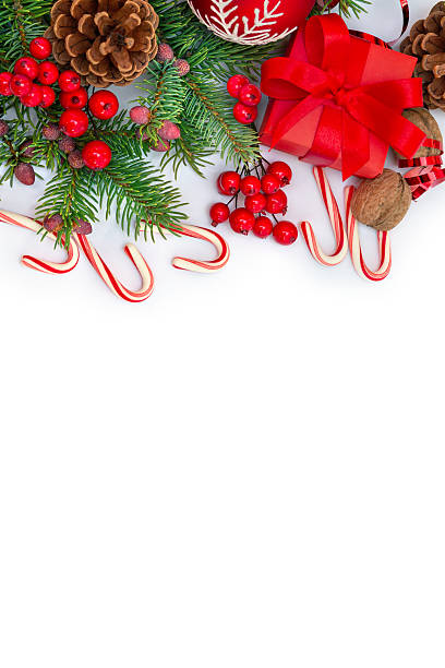 istock Christmas composition with gift box, red ornaments, candy canes and fir branches on white background. Top view, flat lay 2250011770