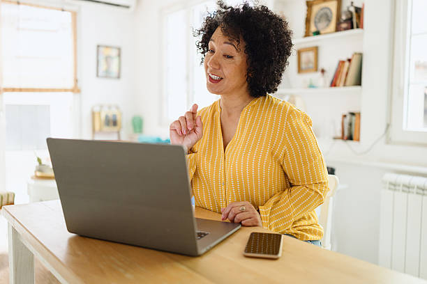 istock Mature Woman on Video Call from Home Office 2250013803