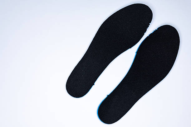 istock Shoe inserts on a white background. Comfortable orthopedic shoe accessories. 2250016109