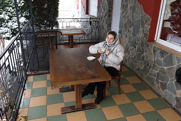 woman with short hair sits at a table in a cafe cocktail vacation. High quality photo