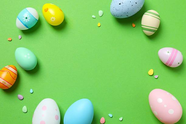 istock Happy Easter. Colorful eggs on green background, space for text or advertising 2250018978
