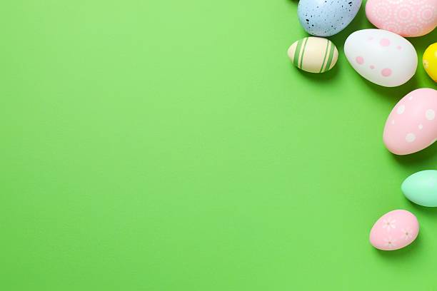 istock Happy Easter. Colorful eggs on green background, space for text or advertising 2250019003