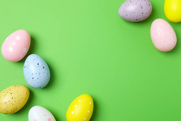 istock Happy Easter. Colorful eggs on green background, space for text or advertising 2250019018