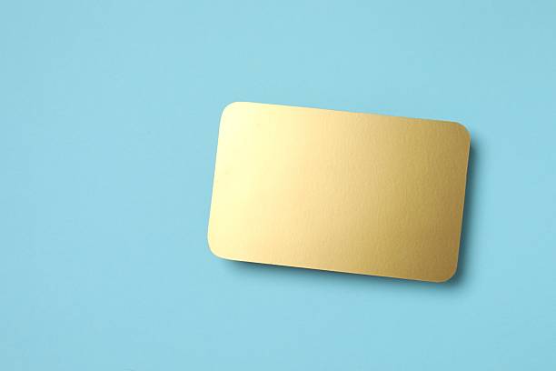 istock Golden paper card on color background 2250020598
