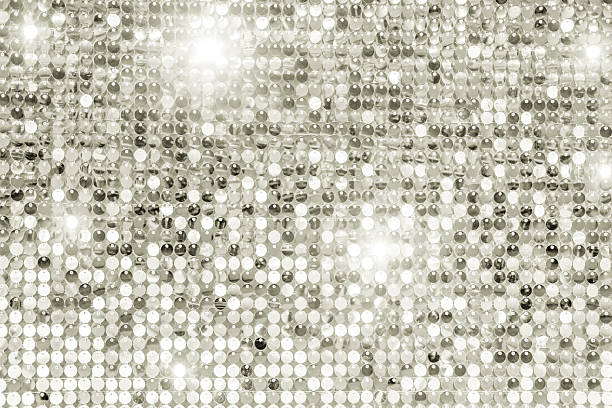 istock Silver sequin background creating glittering disco texture. Color of 2026 year - dancer in the white cloud 2250021658