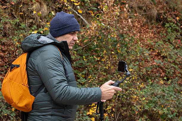 Capturing nature's beauty with a smartphone while hiking in autumn's colors