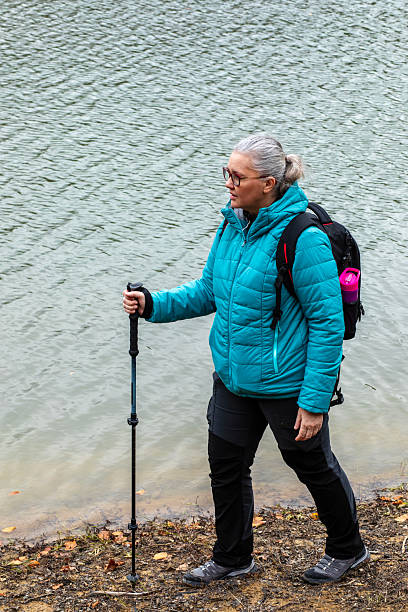 istock Enjoying a tranquil hike by the lakeside during autumn's cool embrace 2250021802