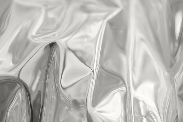 istock Metallic foil textures with flowing folds and abstract reflections for modern design and texture Demonstration Color of the Year 2026 2250023261