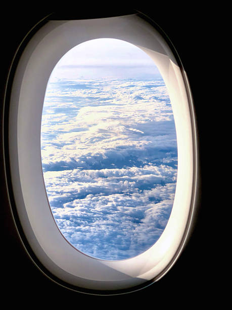 istock View of Clouds from Airplane Window During Flight 2250023773