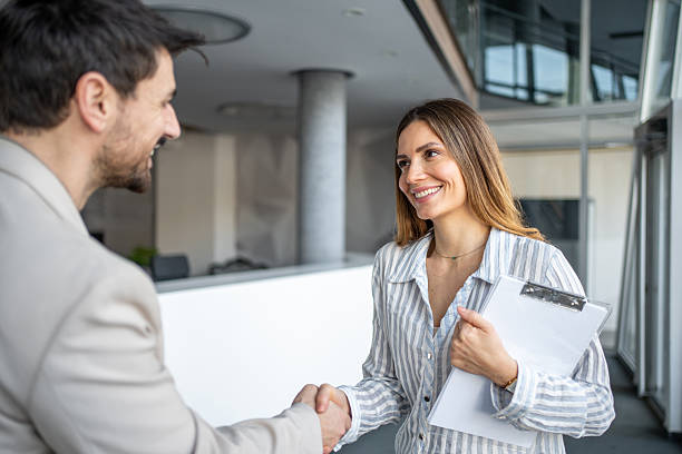 istock Business people shaking hands confirming agreement 2250025348