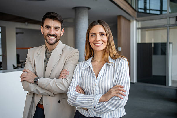 istock Business colleagues standing together in a modern office 2250025415