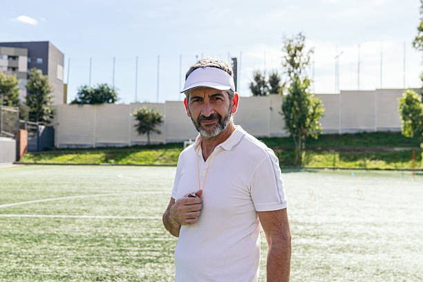istock Soccer coach holding whistle on sunny field 2250026170