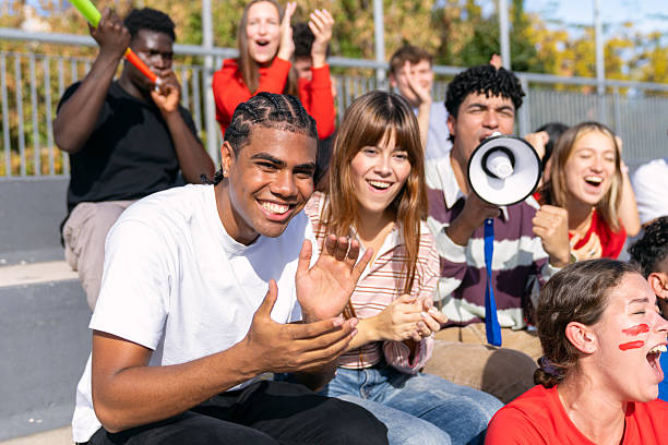 istock Multi-ethnic young people cheering loudly at stadium 2250027492