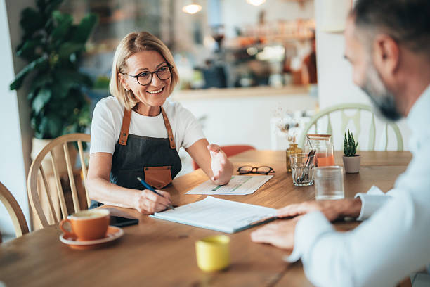 istock Small business owner discussing financing options with loan agent 2250028338