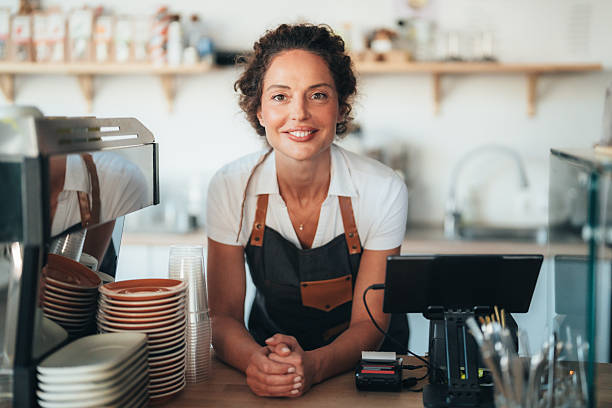 istock Confident barista owner ready to serve with a smile 2250028353