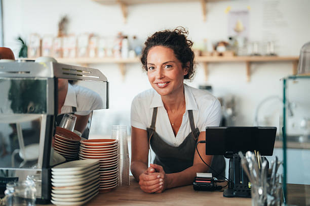 istock Confident barista owner ready to serve with a smile 2250028356