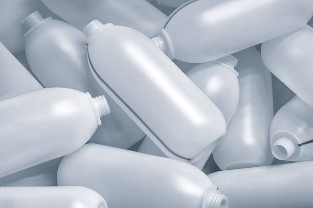 istock White plastic bottles made by extrusion method lie as textured industrial background for web banner page template 2250029465