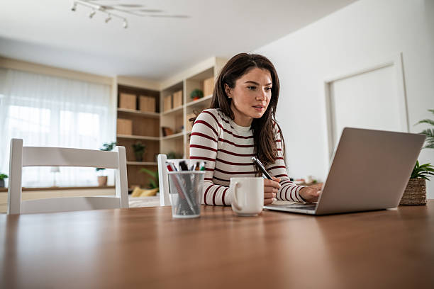 istock Woman working on laptop in modern home office 2250029670