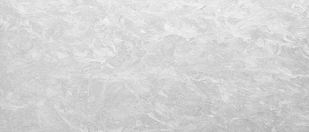 istock A white wall with a grey texture. The wall is smooth and has a clean, minimalist appearance texture as an abstract texture background for template pages and banners 2250032174