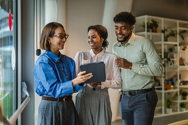 istock Diverse business team collaborating with digital tablet in office 2250033368