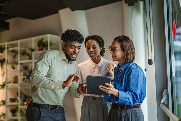 istock Diverse business team collaborating with digital tablet in office 2250033665