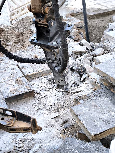 istock An excavator's hydraulic jackhammer destroys paving slabs. 2250034042