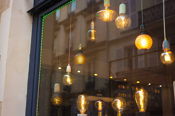 Paris, France: Modern Lit Lamps Hanging in Shop Window, the Marais