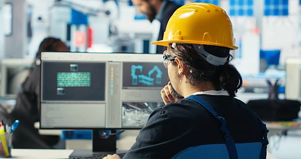 istock Solar panels manufacturing plant technician designing conveyor belts on PC 2250035605