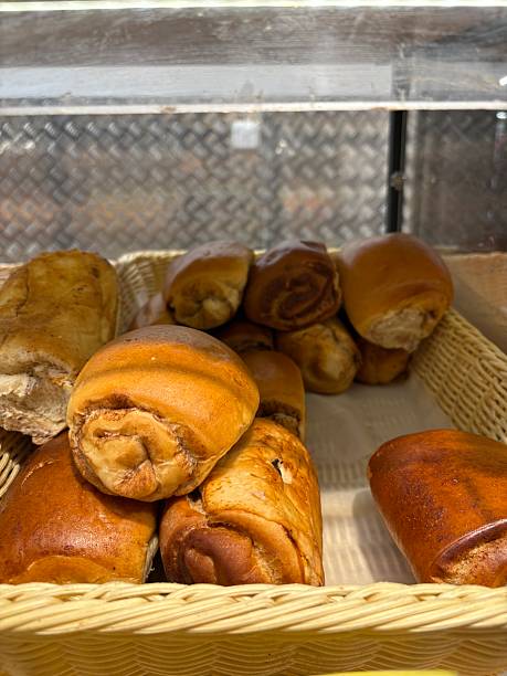fresh baked goods and sweet buns on a store shelf