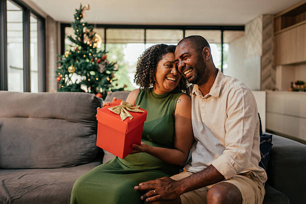 istock Husband gives wife a gift for Christmas. 2250036600