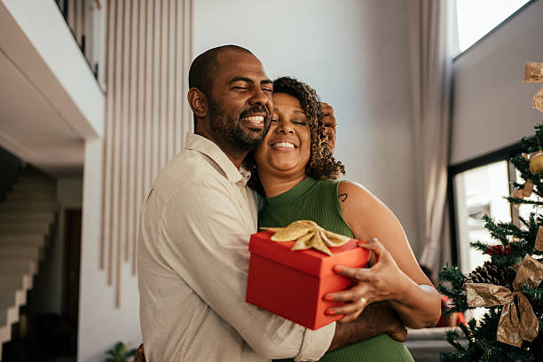 istock Husband gives wife a gift for Christmas. 2250036748