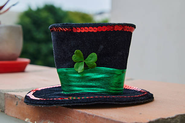 This vibrant green top hat features a shamrock and festive text, perfect for celebrating St. Patrick's Day, representing joy, good luck, and the spirit of Irish culture during joyful gatherings and celebrations.