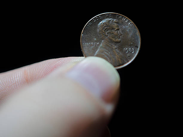 istock Collectible 1989 Lincoln Penny Held by Finger 2250041105