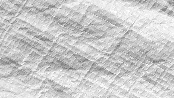 istock Clean White Woven Plastic Tarpaulin Texture Background with Crinkled Surface and Diagonal Grid Pattern for Minimal Design 2250042415