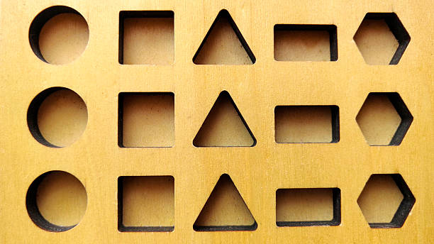 istock Wooden Shape Sorter Puzzle Board with Geometric Cutouts of Circle Square Triangle Rectangle Hexagon for Education and Problem Solving 2250042509