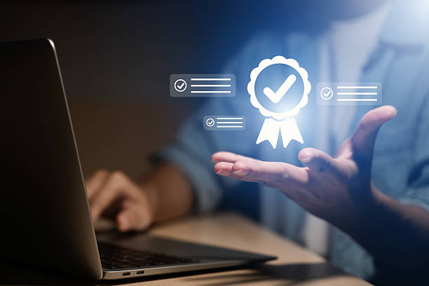 istock Man checking quality assurance compliance and guaranteed service standard on virtual screen. Successful management systems, ISO certification, company audit, product quality control 2250045890