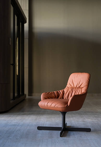 istock Single Modern Leather Chair in Minimalist Interior Space 2250053022