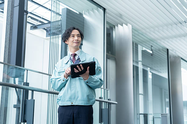 istock Male engineer performing building maintenance 2250053129