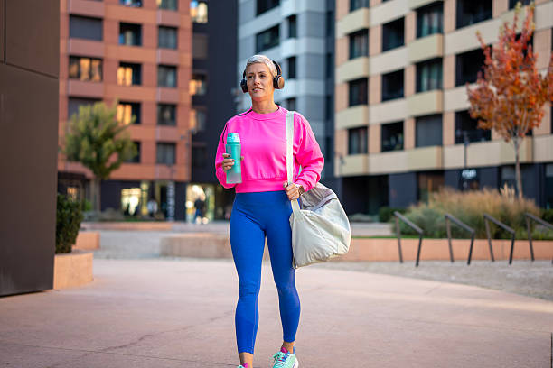 istock Woman walking in urban area after workout 2250054870