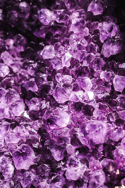 istock Vivid amethyst crystal cluster with rich purple tones and sharp geometric facets 2250056852