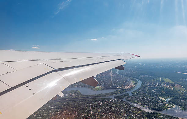 View from the airplane window during takeoff at Sheremetyevo airport at summer. Moscow, Russia