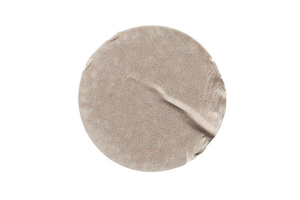 istock Blank brown round adhesive paper sticker label isolated on white background 2250058188