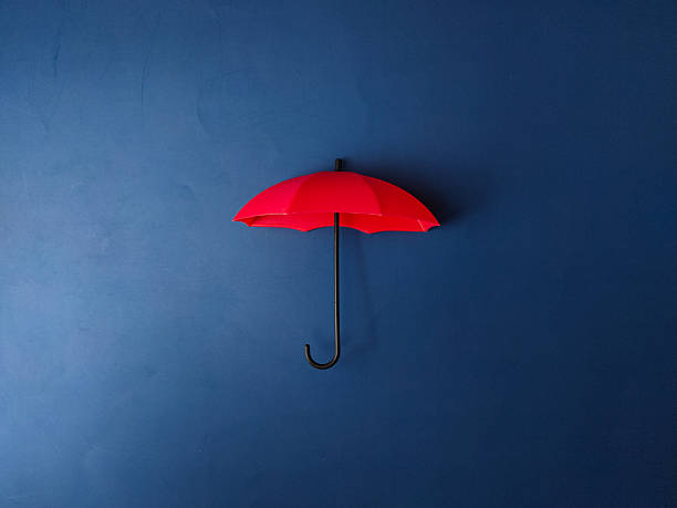 istock The image displays a red umbrella on a blue background 2250058595