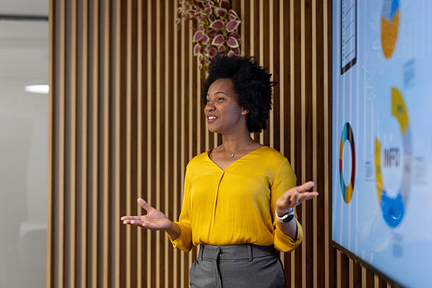 istock Confident businesswoman giving presentation in modern office 2250058828