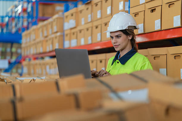 istock Warehouse worker working in warehouse storage. Foreman or worker work at factory site check up products in site. Inventory worker working in  factory Storehouse 2250061343