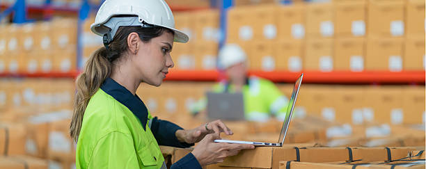 istock Warehouse worker working in warehouse storage. Foreman or worker work at factory site check up products in site. Inventory worker working in  factory Storehouse 2250061365