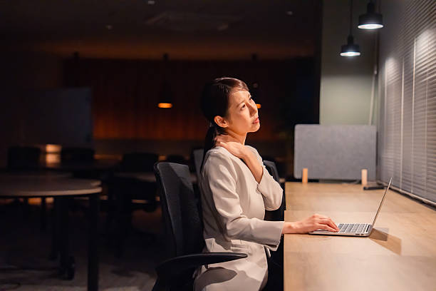 istock Tired female managers working overtime until dark in the office 2250061722