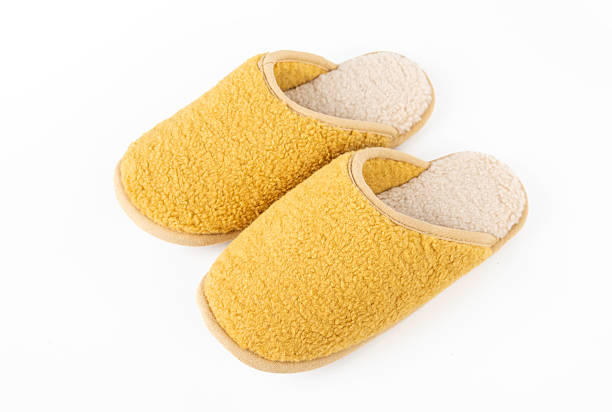 istock Yellow Fleece Indoor Slippers on White Background 2250064873