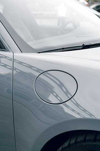 istock Car close-up with fuel cap in a modern garage setting during daylight hours 2250065800