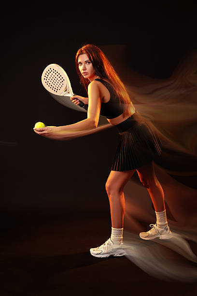istock Tennis player preparing to serve a ball in a dramatic indoor setting 2250066020